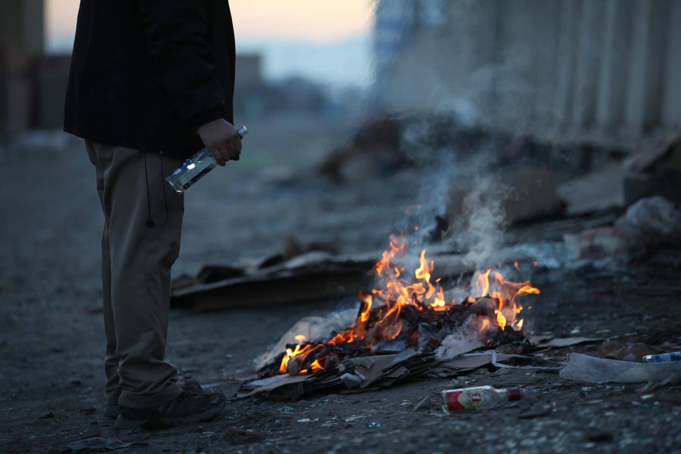 Homeless men in Mongolia living rough on the streets, taking shelter underground for warmth.