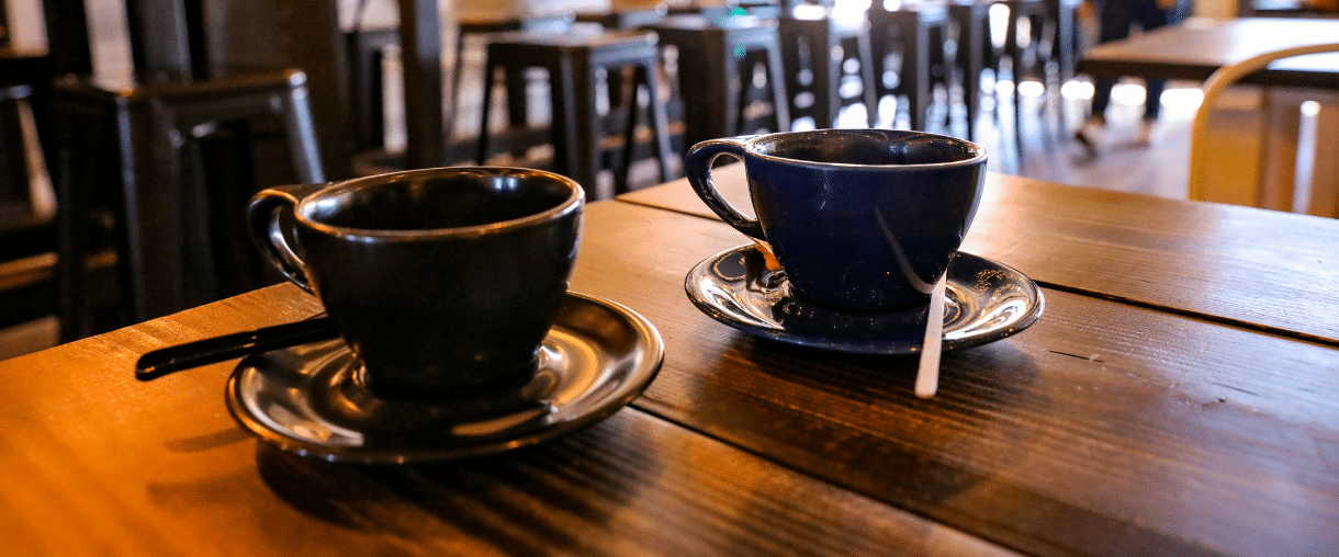 Two cups in a coffee shop